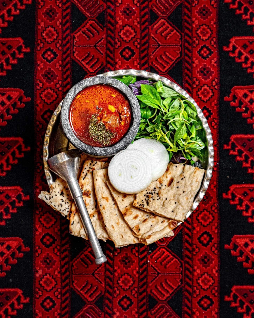 Abgoosht with naan, onions, and herbs served at Crystal Restaurant in Croydon. 